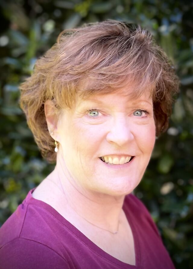 Ann Glaser, licensed clinical social worker, smiling outdoors